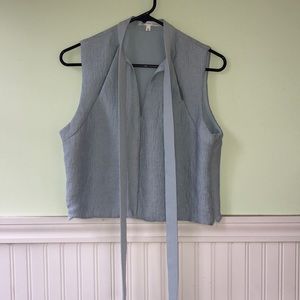 Baby blue sleeveless blouse